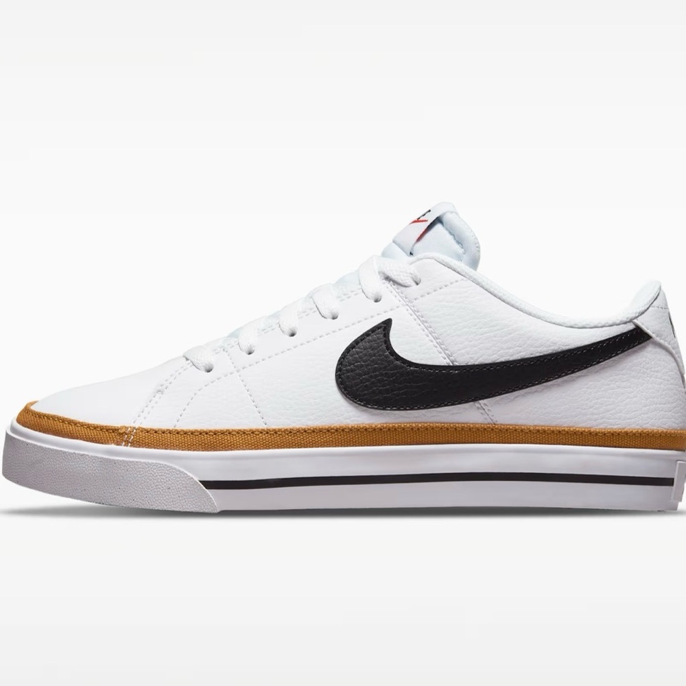 Nike White Athletic Sneakers with Black Swoosh and Brown Accent